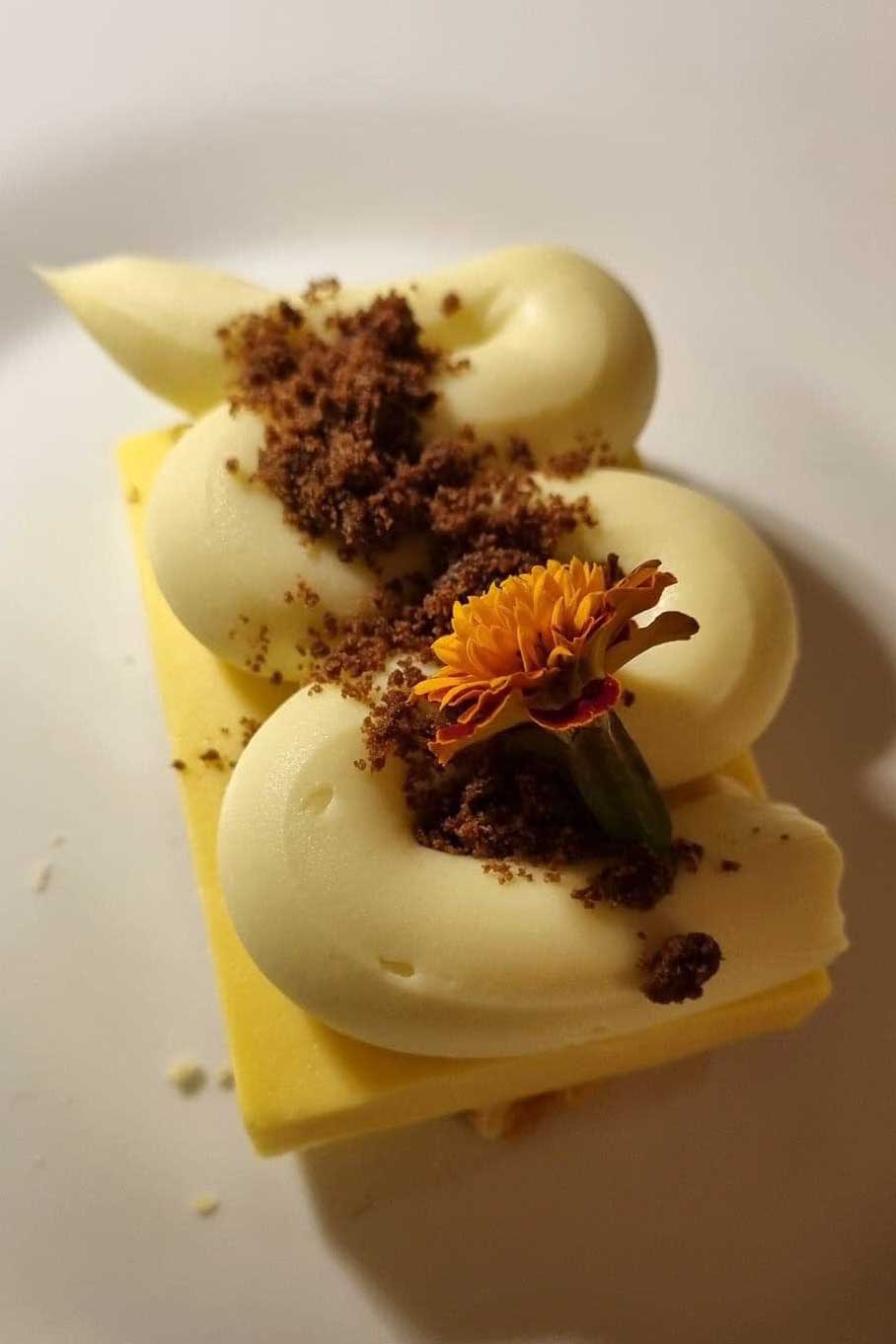 Passion fruit mousse with olive oil cream and hazelnut crumble – Tipico Osteria Montone