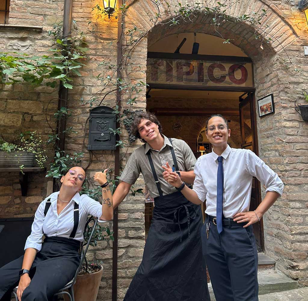 The staff of Osteria Tipico taking a break outside the osteria