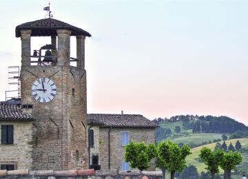 Civic tower with clock in the medieval village of Montone, Umbria, Italy