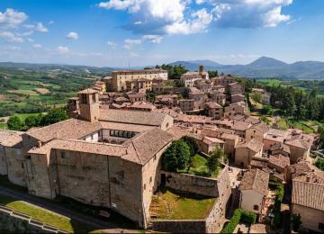Panoramic view of the medieval village of Montone surrounded by Umbrian hills